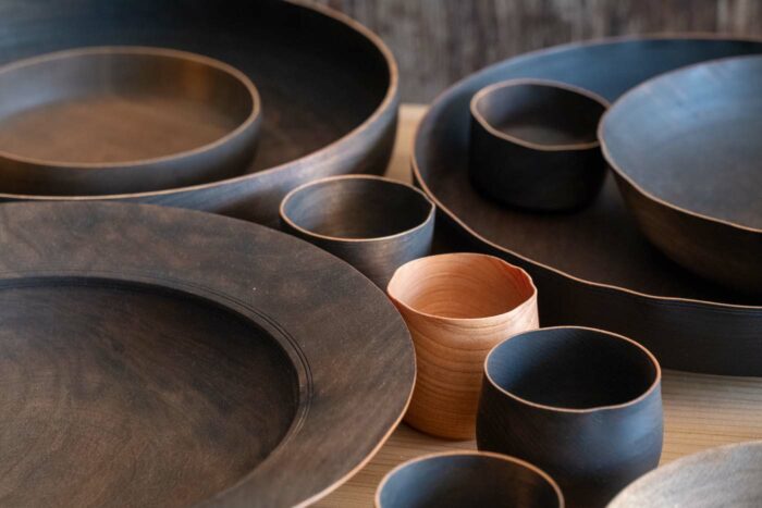 dark wood cups, bowls, and plates by jon billing