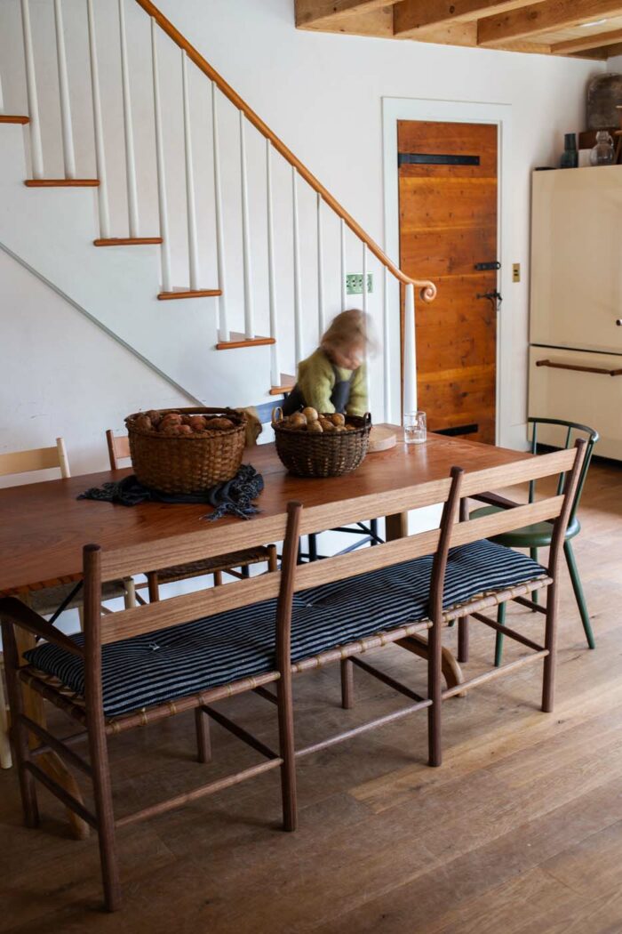 wood dinning table set by Brian Persico