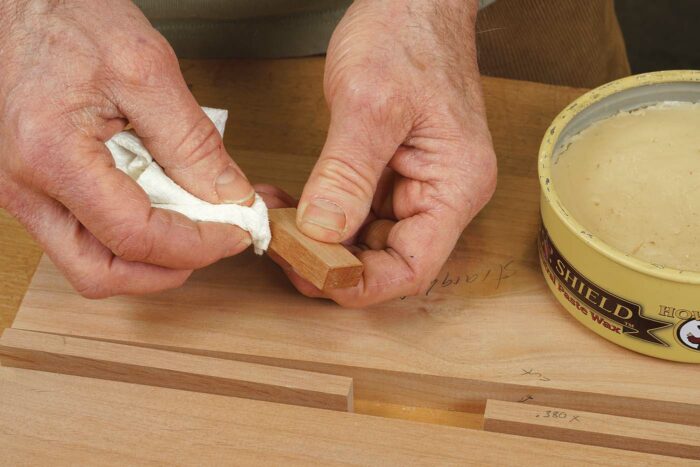 Wax the spacer’s edges so it won’t get glued in place.