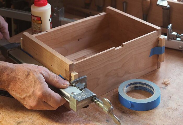 clamping and taping the box to glue