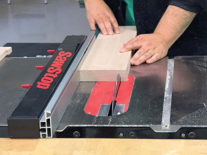 cutting wood plank using T-Glide Advance Rip Fence (ATGP-FA) with table saw